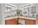 The main bathroom boasts double sinks, generous vanity space, and decorative mirrors, blending practicality with elegance at 2932 Blackwater Oaks Dr, Mulberry, FL 33860