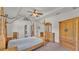 The main bedroom boasts a decorative ceiling fan, and wooden furniture, creating a comfortable and stylish retreat at 2932 Blackwater Oaks Dr, Mulberry, FL 33860