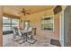 Outdoor patio with neutral brick pavers, a ceiling fan, and dining table with six chairs at 2932 Blackwater Oaks Dr, Mulberry, FL 33860