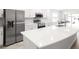 Modern kitchen with stainless steel appliances, white cabinetry, and an island at 3167 Laurel Oak Ln, Winter Haven, FL 33884