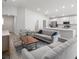 Open-concept living area with neutral tones and a seamless flow into the kitchen at 3167 Laurel Oak Ln, Winter Haven, FL 33884