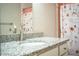 Bathroom sink with a white granite countertop and brushed metal faucet at 3542 Raintree Ct, Lakeland, FL 33803