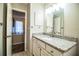 Bright bathroom highlighting a granite vanity, modern fixtures, and well-lit mirror at 3542 Raintree Ct, Lakeland, FL 33803