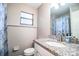 Bathroom featuring a granite countertop, modern faucet, toilet, and neutral wall paint at 3542 Raintree Ct, Lakeland, FL 33803