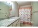 Bathroom featuring a vanity with granite countertop and decorative shower curtain at 3542 Raintree Ct, Lakeland, FL 33803