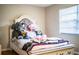 Cozy bedroom showcasing a stylish bed frame and plush teddy bear accents at 3542 Raintree Ct, Lakeland, FL 33803
