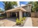 Home featuring covered parking, a welcoming front entrance, and a neatly landscaped walkway at 3542 Raintree Ct, Lakeland, FL 33803