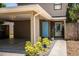 Inviting home with covered parking, showcasing a quaint front walkway and an eye-catching blue entrance at 3542 Raintree Ct, Lakeland, FL 33803