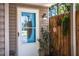 Charming home entrance with decorative door, sidelight, stylish light fixture, and artful fence detail at 3542 Raintree Ct, Lakeland, FL 33803