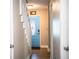 Hallway leading to a decorative blue front door with an oval window at 3542 Raintree Ct, Lakeland, FL 33803
