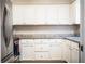 The kitchen offers white cabinetry, granite countertops, and stainless appliances for a modern and functional cooking space at 3542 Raintree Ct, Lakeland, FL 33803