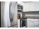 Kitchen with stainless steel appliances, granite countertops, and white cabinetry at 3542 Raintree Ct, Lakeland, FL 33803