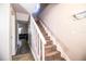 Carpeted staircase with white railing leading up from living area at 3542 Raintree Ct, Lakeland, FL 33803