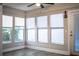 Sunroom with hardwood-style flooring and multiple windows, bringing in plenty of natural light at 3542 Raintree Ct, Lakeland, FL 33803