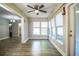 Bright sunroom with hardwood floors and large windows offering plenty of natural light at 3542 Raintree Ct, Lakeland, FL 33803