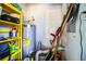 The utility room houses the water heater and storage shelves at 3542 Raintree Ct, Lakeland, FL 33803