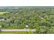 Lot with abundant tree coverage and lush greenery creates a natural setting at 4035 K Ville Ave, Auburndale, FL 33823