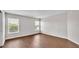 Bright bedroom with two windows and wood-look flooring at 4143 Red Fern Ln, Lakeland, FL 33811