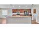 Spacious kitchen with stainless steel appliances and a large center island at 4143 Red Fern Ln, Lakeland, FL 33811