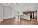 Open-concept living space with wood floors and slider doors leading to the backyard at 4143 Red Fern Ln, Lakeland, FL 33811