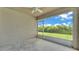 Screened patio, complete with a ceiling fan, and backyard view at 4143 Red Fern Ln, Lakeland, FL 33811
