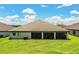 Beautiful home featuring a well-maintained lawn and a spacious screened patio, perfect for outdoor enjoyment at 4222 Juliana Lake Dr, Auburndale, FL 33823