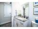 Clean bathroom with granite countertop, white vanity, and ample storage space at 4222 Juliana Lake Dr, Auburndale, FL 33823