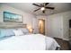 Bedroom featuring a comfortable bed with a view to the ensuite bathroom and closet at 4222 Juliana Lake Dr, Auburndale, FL 33823