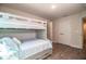 Bright bedroom featuring a bunk bed, wood-look floors, and a convenient closet at 4222 Juliana Lake Dr, Auburndale, FL 33823
