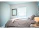 Bedroom showcasing a comfortable bed, natural light, and minimalist decor at 4222 Juliana Lake Dr, Auburndale, FL 33823