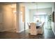 Open-concept view into dining area from entryway, featuring elegant chandelier and table centerpiece at 4222 Juliana Lake Dr, Auburndale, FL 33823
