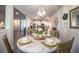 Charming dining area featuring a round table, wooden chairs, and stylish light fixture at 4222 Juliana Lake Dr, Auburndale, FL 33823