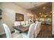 Spacious dining room featuring a large table with seating for eight and a view into the living room at 4222 Juliana Lake Dr, Auburndale, FL 33823