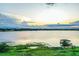 Beautiful lake view featuring a private dock with a gazebo, reflecting peaceful waterfront living at 4222 Juliana Lake Dr, Auburndale, FL 33823