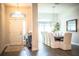 Welcoming entryway with front door view leading into formal dining room featuring elegant decor at 4222 Juliana Lake Dr, Auburndale, FL 33823