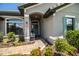 Charming front entrance with a beautifully landscaped walkway and inviting curb appeal at 4222 Juliana Lake Dr, Auburndale, FL 33823