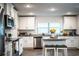 Well-lit kitchen with an island, stainless steel appliances and granite countertops at 4222 Juliana Lake Dr, Auburndale, FL 33823