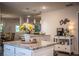 Open concept kitchen with an island, pendant lights and a coffee bar at 4222 Juliana Lake Dr, Auburndale, FL 33823