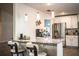 Stylish kitchen featuring pendant lighting, granite counters, stainless appliances, and breakfast bar at 4222 Juliana Lake Dr, Auburndale, FL 33823