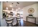Spacious kitchen featuring granite counters, stainless appliances, white cabinets, and a large breakfast bar at 4222 Juliana Lake Dr, Auburndale, FL 33823