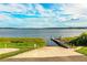 Picturesque shot of the community boat ramp offering direct lake access with clear blue skies and calm water at 4222 Juliana Lake Dr, Auburndale, FL 33823