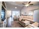 Bright living room with neutral colors, comfortable seating and wood-look flooring at 4222 Juliana Lake Dr, Auburndale, FL 33823