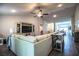 Spacious living room with a large comfortable sectional and entertainment center at 4222 Juliana Lake Dr, Auburndale, FL 33823