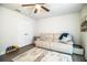 Versatile living room with a comfortable sofa, ceiling fan, and ample natural light at 4222 Juliana Lake Dr, Auburndale, FL 33823