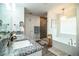 A luxurious main bathroom with double sinks, a soaking tub, and a separate shower with tile surround at 4222 Juliana Lake Dr, Auburndale, FL 33823
