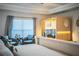 A view of a light-filled main bedroom featuring a sitting area and personal sauna at 4222 Juliana Lake Dr, Auburndale, FL 33823