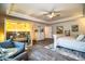 A spacious main bedroom complete with a sauna, sitting area, and weathered white furniture at 4222 Juliana Lake Dr, Auburndale, FL 33823