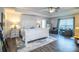A spacious main bedroom featuring a ceiling fan and wood-look flooring and a bright, airy ambiance at 4222 Juliana Lake Dr, Auburndale, FL 33823