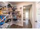 Spacious walk-in pantry with ample shelving for organized storage and easy access to supplies at 4222 Juliana Lake Dr, Auburndale, FL 33823