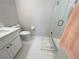 Clean bathroom with tiled floors, white vanity, toilet, and glass-enclosed shower stall at 443 Enclave Pl # 0, Lakeland, FL 33803